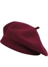 Burgundy beret hat with a small stem on top, shown from multiple angles.