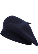 Side view of a dark navy classic beret with a small stem on top