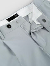 Men's sage green pleated trousers with button and pocket detail