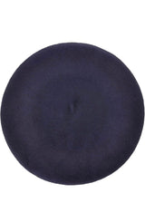 Close-up of a dark navy blue beret with a small stem on top, viewed from various angles.